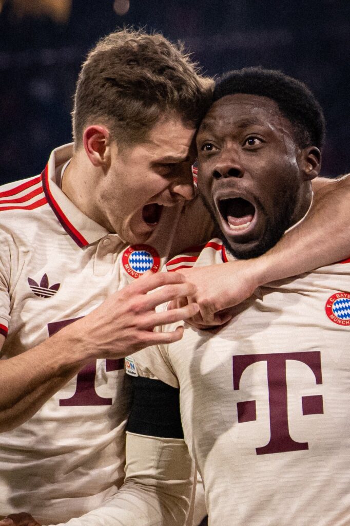Defender, Alphonso Davies, celebrates goal for Bayern Munich with teammate in the Uefa Champions League 2024/25 Knockout Play-off against Celtic at Allianz Arena on Tuesday 18 February, 2025