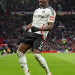 Nigerian centre-back Calvin Bassey celebrates after scoring for Fulham in the FA Cup 2024/25 fifth round match against Manchester United at Old Trafford on Sunday 2 March, 2025