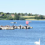 Boat capsized on reservoir, son found, dad missing