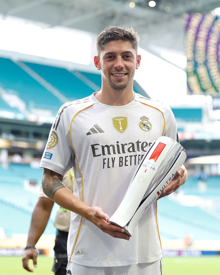 Federico Valverde poses with his Most Valuable Player (MVP) award for his performance for Real Madrid against Juventus