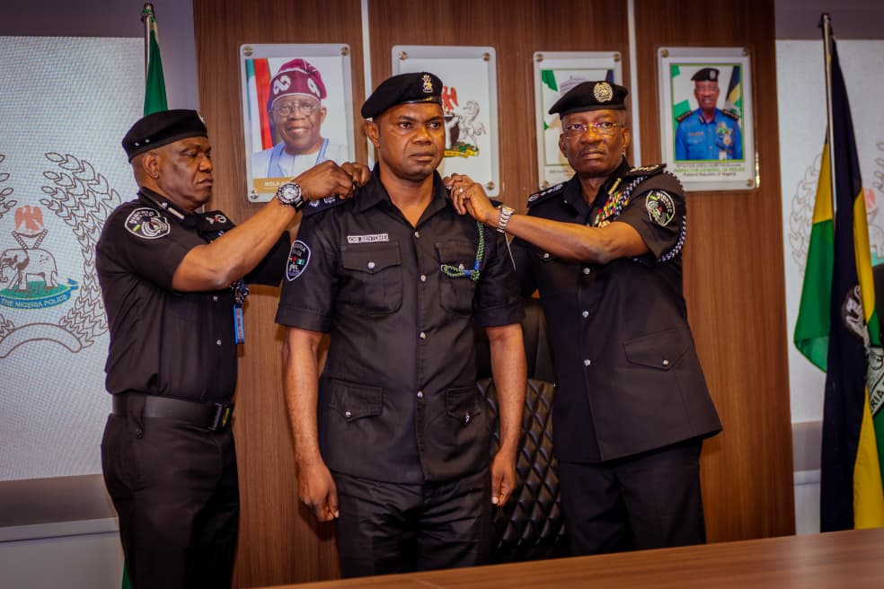 IGP Kayode Egbetokun decorates Police Officer Of The Year at Force Headquarters, Abuja.