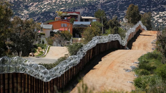 US-Mexico border wall to be painted black to stop climbers