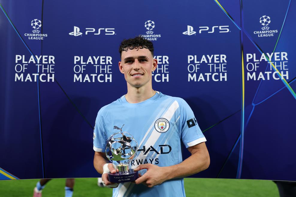 Phil Foden poses with his Player Of The Match award