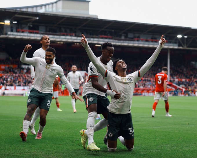 Josh Acheampong celebrates his first goal for Chelsea with teammates at City Ground.