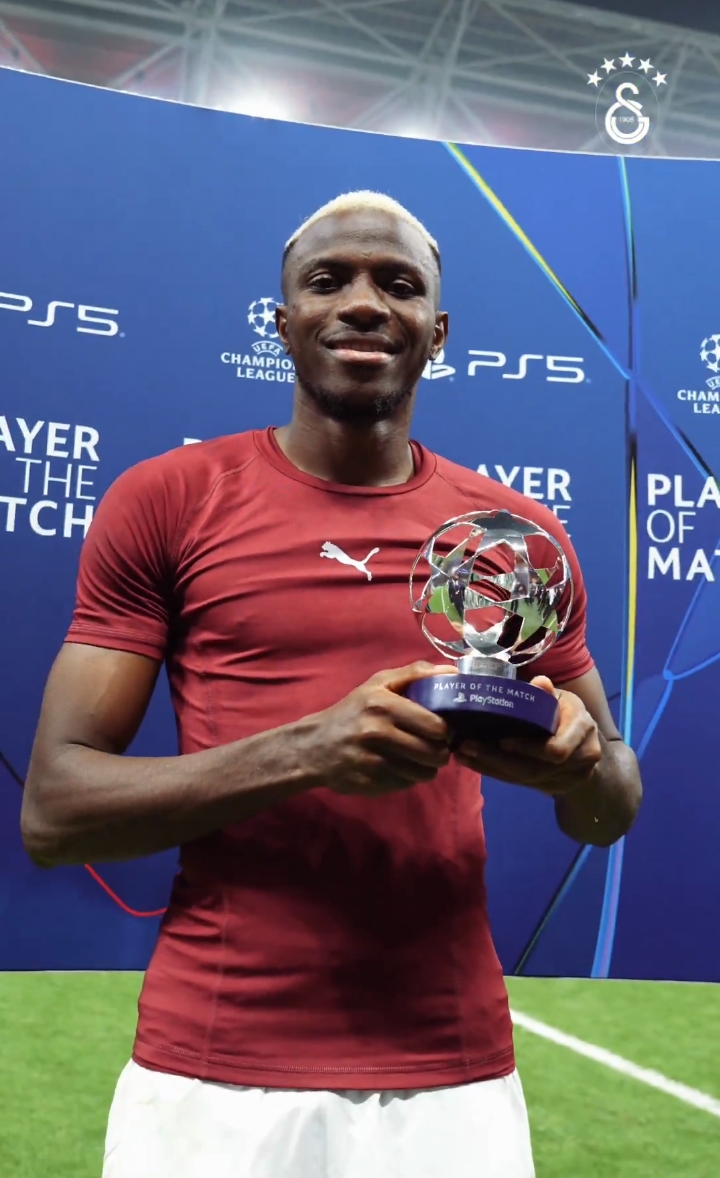 Galatasaray striker, Victor Osimhen, takes a shot with his Man Of The Match award