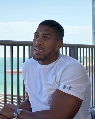 Anthony Joshua and mother pay final respects to boxer’s two friends