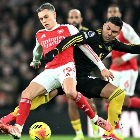 Arsenal's Leandro Trossard and Manchester United's Casemiro jostle for the ball during the Premier League showdown at Emirates Stadium last Sunday