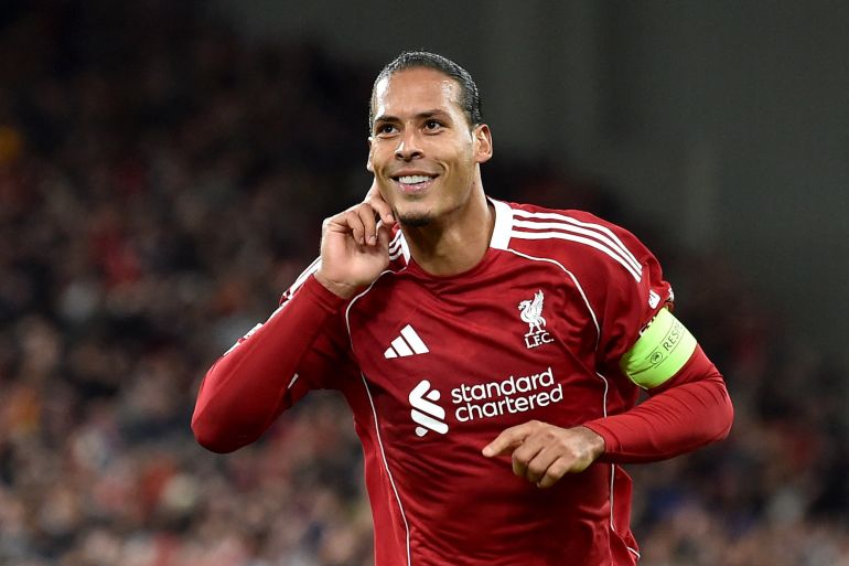 Liverpool defender, Virgil Van Dijk, celebrates after scoring for the Reds