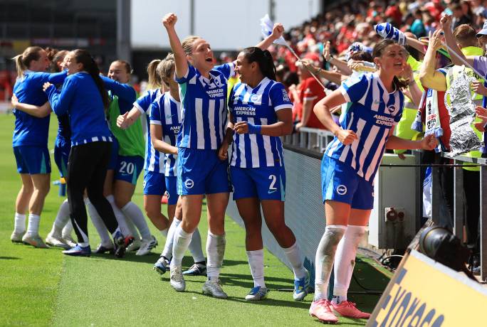 Brighton and Hove Albion Women players celebrate after besting Liverpool 3-2 to reach the Women's FA Cup final