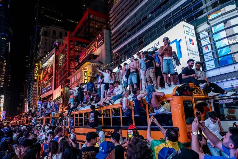 Teenager shot and buses set ablaze in New York City after Knicks NBA Championship win 2 Crowd on a school bus
