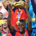 Winger, Nico Williams, lifts the World Cup trophy. He assisted the goal that was netted by Ferran Torres to give Spain the victory over Argentina in the final in New York, US