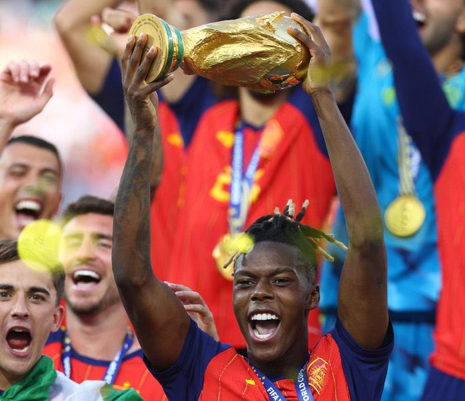 Winger, Nico Williams, lifts the World Cup trophy. He assisted the goal that was netted by Ferran Torres to give Spain the victory over Argentina in the final in New York, US