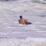 16-year old lifeguard rescues young boy from huge ocean waves in Santa Cruz, California