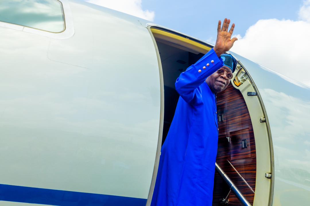 President Bola Ahmed Tinubu waves as he jets out of the country