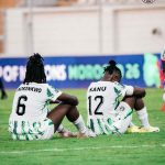 Super Falcons, Esther Okoronkwo and Uchenna Kanu, sitting on the pitch dejected after being knocked out of the CAF Women's Africa Cup of Nations (WAFCON) 2026 0-1 by Cameroon in the quarter finals in Casablanca, Morocco on Sunday 9 August, 2026 | NGSuper_Falcons/X