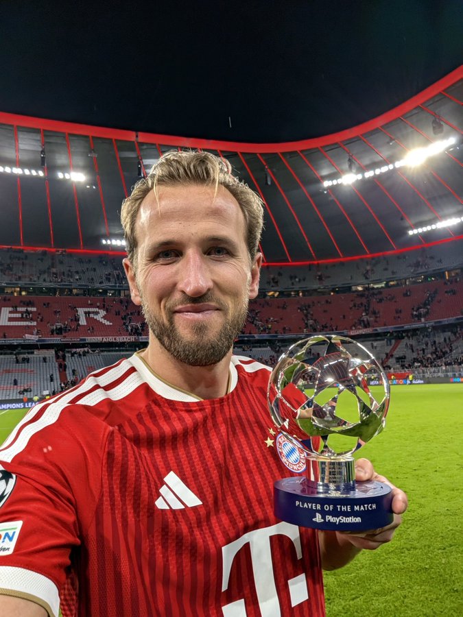 Bayern Munich English forward, Harry Kane, takes a shot with his Player Of The Match (POTM) award following his heroics for the Bavarians in the Uefa Champions League match against Arsenal in Munich on Wednesday 21 October, 2026
