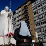 A statue of late Pope John Paul II stands outside the Gemelli Hospital. Pope Leo XIV was operated right in this facility